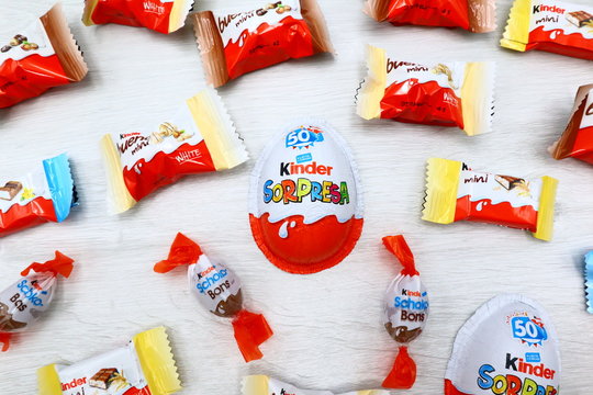 Italy – July 20, 2019: Kinder Surprise, Kinder mini Bars, mini Bueno and Schoko-Bons Chocolates. Kinder is a brand of products made in Italy by Ferrero