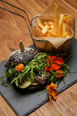 Teriyaki beef burger with arugula served with french fries