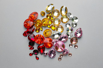 Different precious stones for jewellery on light background