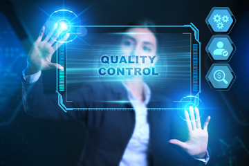 Business, Technology, Internet and network concept. Businessman presses a button Quality control on the virtual screen tablet future.