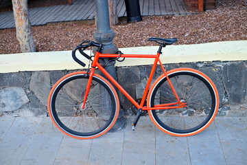 Bright orange modern designer bicycle.
