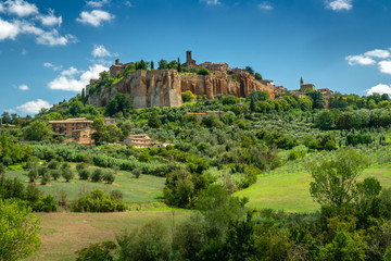 Fototapeta na wymiar Orvieto, Umbria Italy. The ancient city of Orvieto is build on the flat summit of a large butte of volcanic tuff. Surrounded by beautyful meadows with olive and cypress trees.
