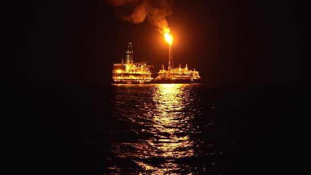 FPSO tanker vessel near Oil platform Rig. Offshore oil and gas industry, sea oil production and storage