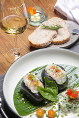 Sea scallop on frozen stone with cucumber spaghetti and citrus dressing. Exquisite dish. Creative restaurant meal concept.	