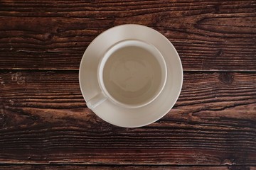a cup on wooden table