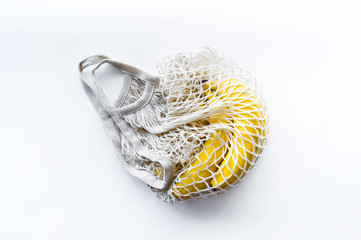 Zero waste. Ecological string bag for products Bunch of yellow bananas