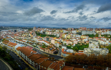 Fototapeta na wymiar Aerial panorama of colorful houses on a hillside neighborhood in Coimbra Portugal