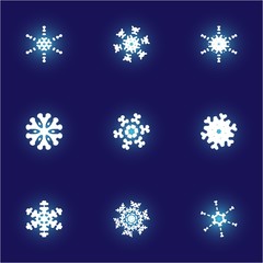 Set of christmas cut-out snowflakes on blue background.