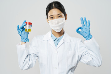 doctor in protective mask with syringe