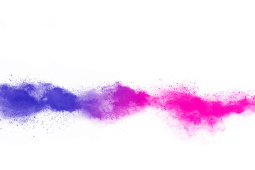Freeze motion of purple color powder exploding on white background.