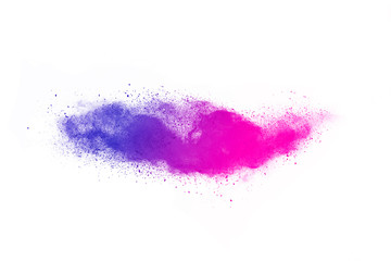 Freeze motion of purple color powder exploding on white background.