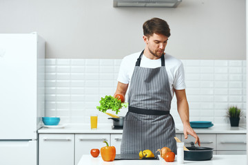 man preparing food in kitchen