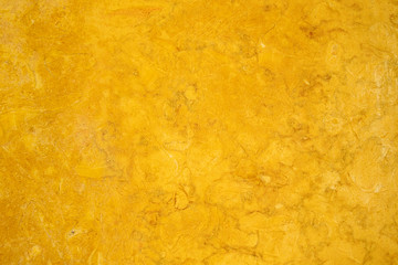 Gold textured polished marbled stone surface background