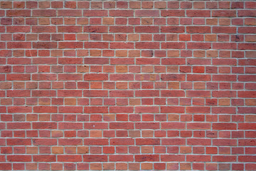 red brick wall with cemented joints background surface