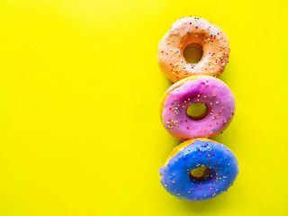 Donuts various flavor have color Orange White Purple Pink,High energy foods and healthy rates,Sweet flavored candy,Mapping background