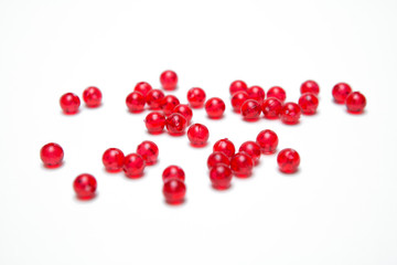 Red beads on a  white background