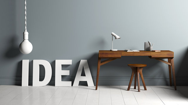 Modern minimalist workstation 3D text "IDEA" and a lightbulb in front of a grey wall