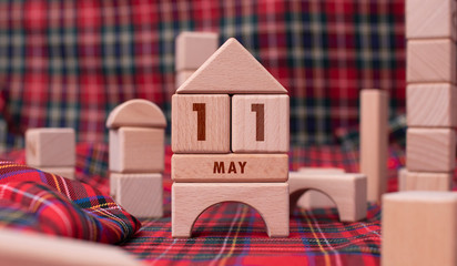 May 11 written with wooden blocks