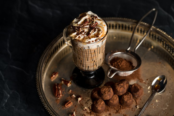 A cup of hot cocoa with truffles