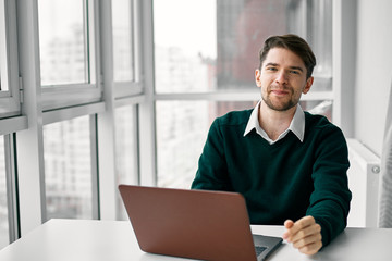 businessman working on his laptop in office