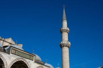 Fototapeta na wymiar Minaret of Suleymaniye Mosque (Suleymaniye Camii). an Ottoman imperial mosque located on the Third Hill of Istanbul, Turkey