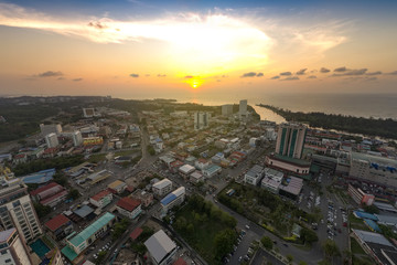 miri, malaysia aerial shot with dramatic sunset in the horizon