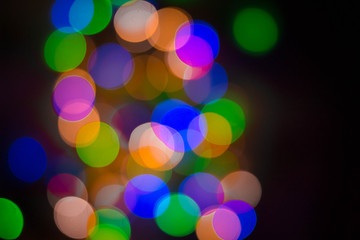 Christmas lights on black background, abstract for text, advert