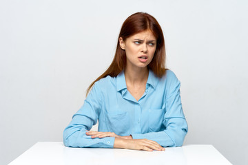 portrait of young woman sitting at her desk