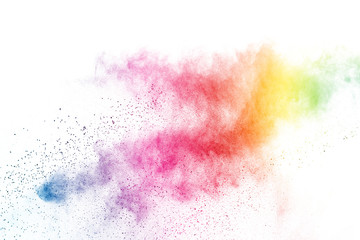 Freeze motion of colorful color powder exploding on white background.  Paint Holi.