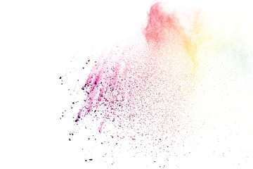 Freeze motion of colorful color powder exploding on white background.  Paint Holi.