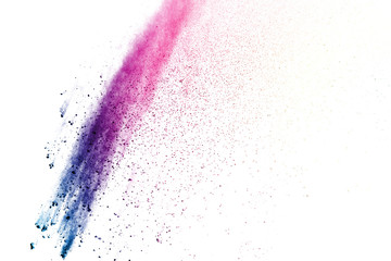 Freeze motion of colorful color powder exploding on white background.  Paint Holi.