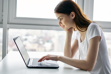 woman working on laptop at home