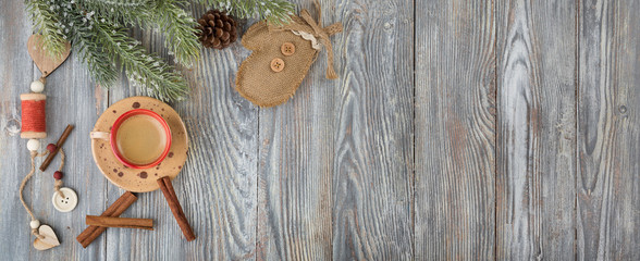Flat lay with craft pottery ceramics cup of coffee decorated by pine tree branches