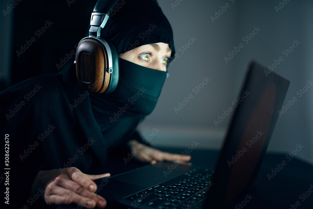 Poster hacker stealing data from laptop