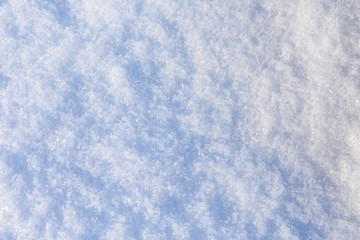 Texture of the white fluffy snow for background