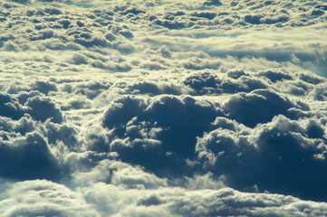 Naklejka premium View of clouds in the sky from an airplane window