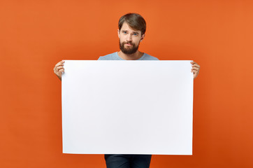 man holding blank board