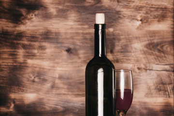 bottle of wine on wooden background