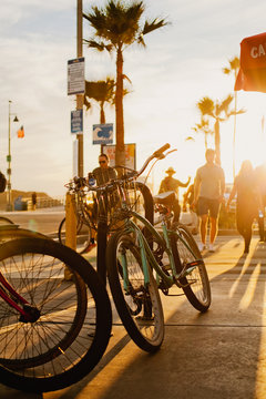 Los Angeles, California / USA - 11.18.2019 : bicycles on the street in the sunset light, Venice beach, California