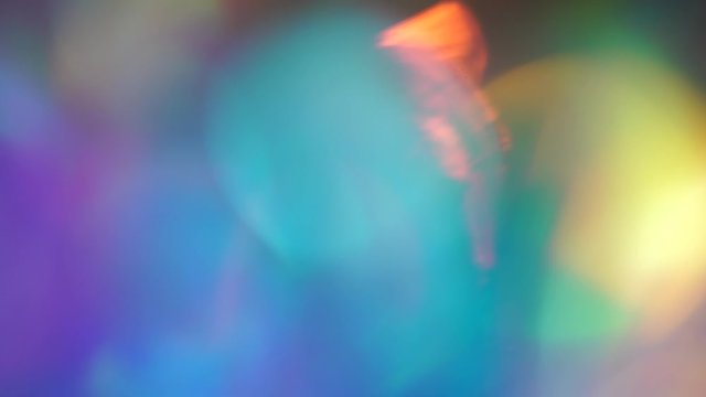 Neon purple blue ultraviolet pink gradient. Moving abstract blurred background. Light through the prism diamond crystal.  The colors vary with position, producing smooth color transitions and bokeh