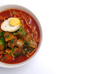 bowl of mutton curry noodle on white background 