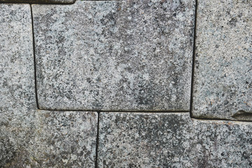 Detail of Inca wall into the lost city of Machu Picchu
