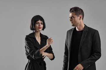 man and woman fighting over white background