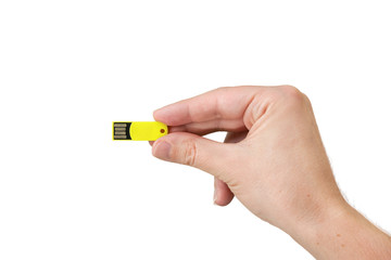 Yellow USB flash memory on hand with isolated white background