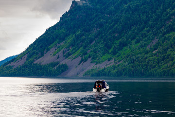A small pleasure boat with a motor for excursions and relaxation in picturesque places on the water...