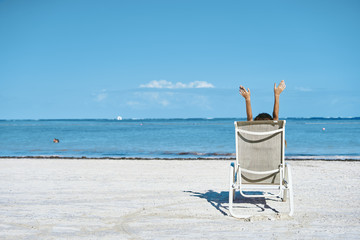 two chairs and umbrella on the beach