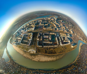 The end of a winter day in a snowless winter is a large panorama of the Yubileiny microdistrict...
