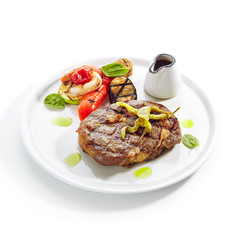 Macro Shot of Pork Neck Steak with Grilled Vegetables Isolated