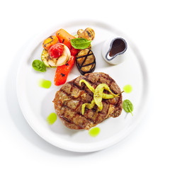Macro Shot of Pork Neck Steak with Grilled Vegetables Isolated