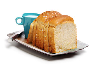 Milk and bread on white background